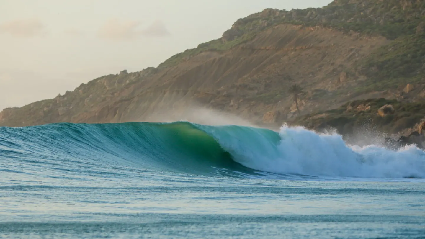 A long wave peeling along the point at Imsouane